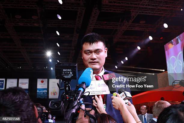 Retired Chinese professional basketball player and member of the Chinese delegation Yao Ming speaks to the press after Beijing, China was announced...