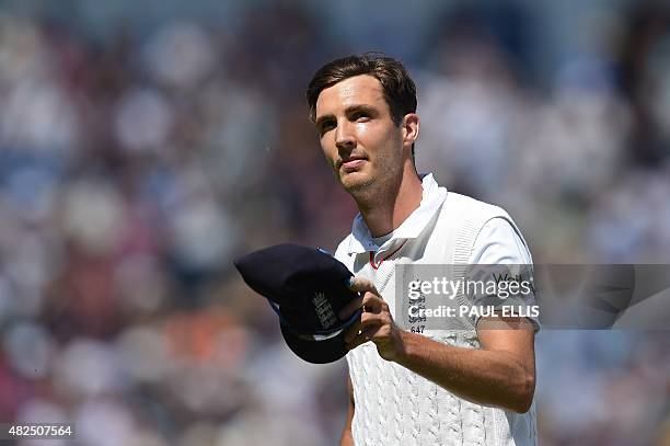 England's Steven Finn acknowledges the crowd as he leaves the field at the end of Australia's second innings on the third day of the third Ashes...