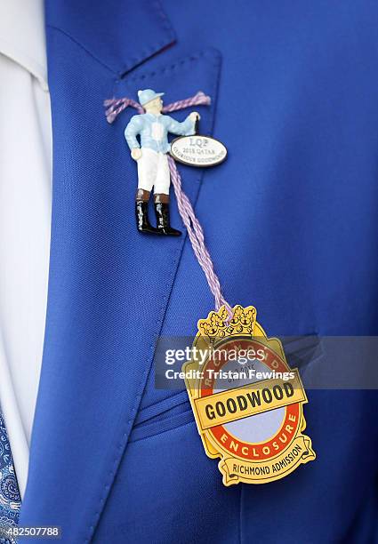 Race goer on day four of the Qatar Goodwood Festival at Goodwood Racecourse on July 31, 2015 in Chichester, England.