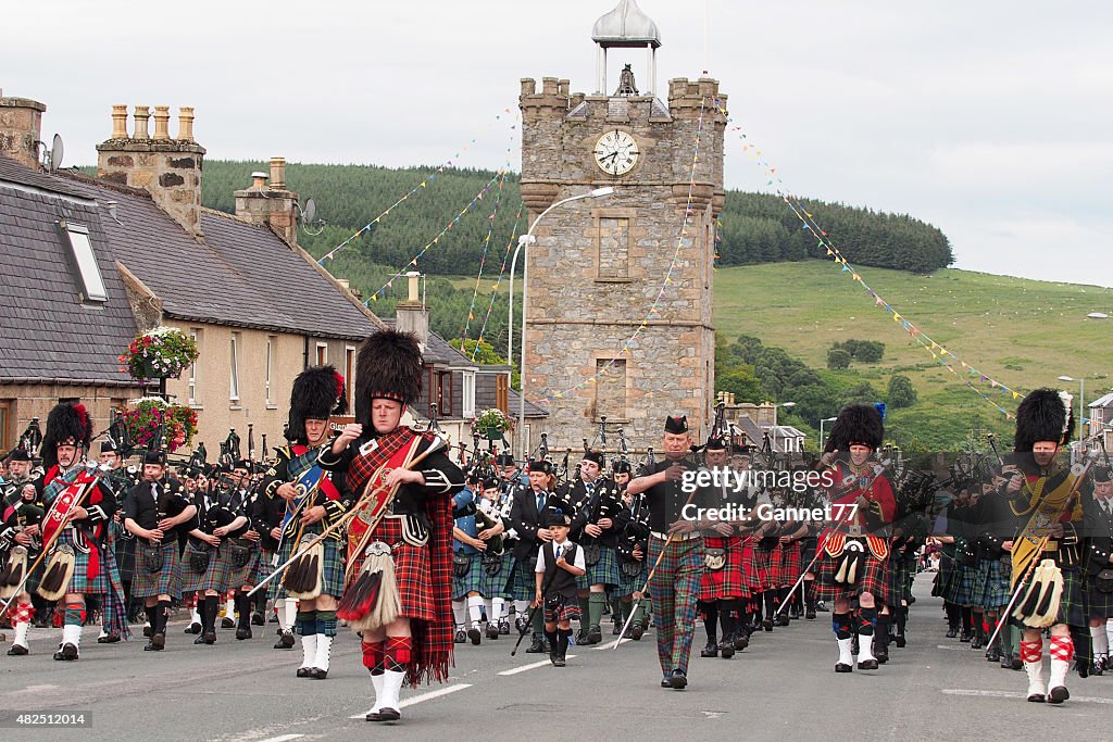 Massed Pipe Bands marching in Dufftown, Scotland.