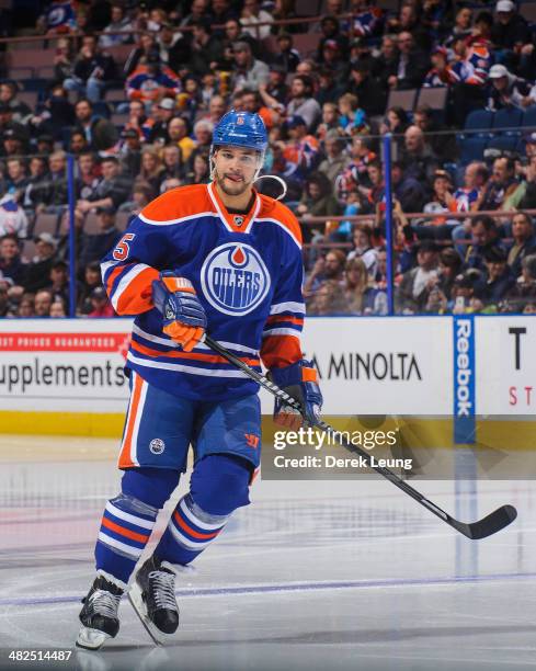 Mark Fraser of the Edmonton Oilers in action against the Buffalo Sabres during an NHL game at Rexall Place on March 20, 2014 in Edmonton, Alberta,...