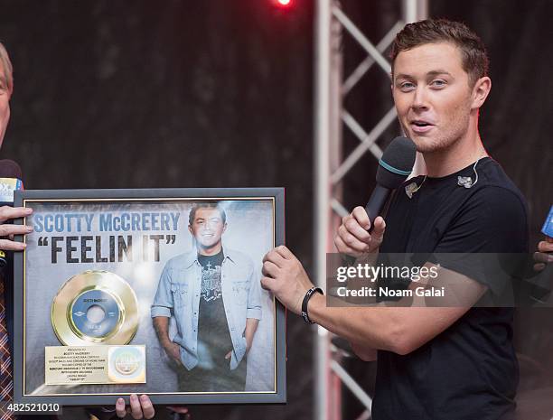 Singer Scotty McCreery awarded with a Gold record for his song "Feelin' it" at the 'FOX & Friends' All American Concert Series outside of FOX Studios...