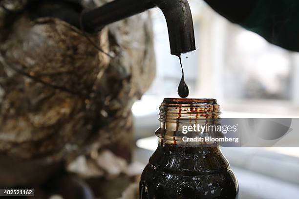 Crude Example Crude Oil Sample Photos and Premium High Res Pictures - Getty Images
