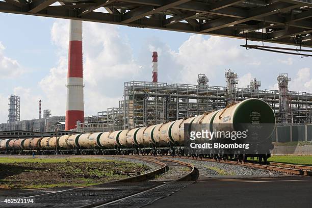 Freight wagons filled with petroleum fuel sit before shipping at the "TANECO" refining and petrochemical plant, operated by Tatneft OAO, in...