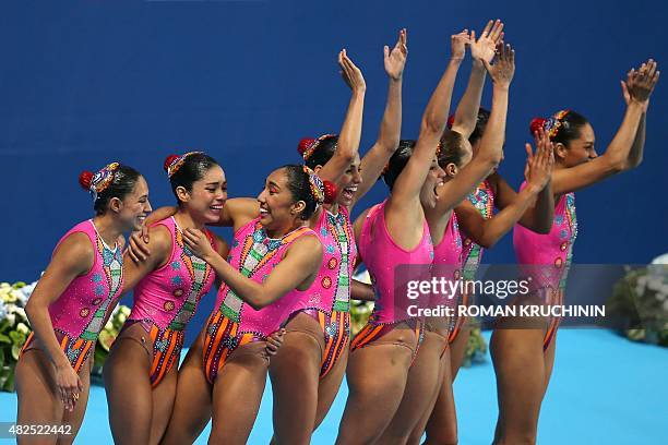 Team Mexico celebrates after competing in the Team Free final event during the synchronised swimming competition at the 2015 FINA World Championships...