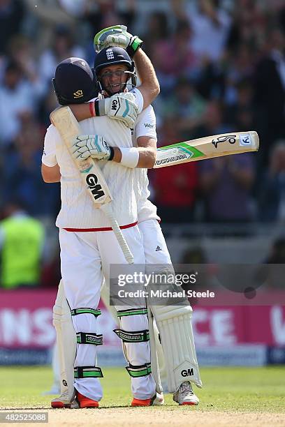 Joe Root of England celebrates with Ian Bell after hitting the winning runs to defeat Australia by 8 wickets during day three of the 3rd Investec...