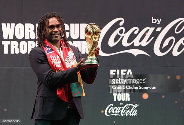 Honorary ambassador Christian Karembeu carries the FIFA World Cup Trophy during the event of presentation as part of the FIFA World Cup Trophy that...
