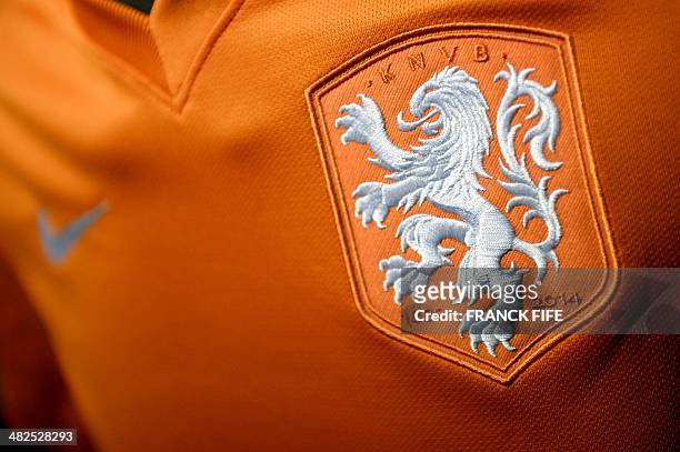 Photo taken on April 3, 2014 in Paris, shows a partial view of the new jersey of The Netherlands' national football team. AFP PHOTO / FRANCK FIFE