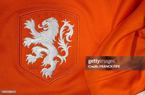 Photo taken on April 3, 2014 in Paris, shows a partial view of the new jersey of The Netherlands' national football team. AFP PHOTO / FRANCK FIFE