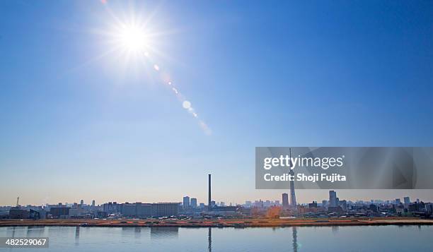 tokyo city with tokyo sky tree at sunny day. - sun flare foto e immagini stock