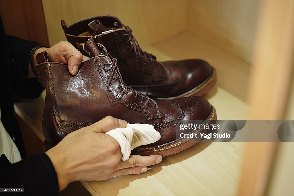 Man polishing leather shoes