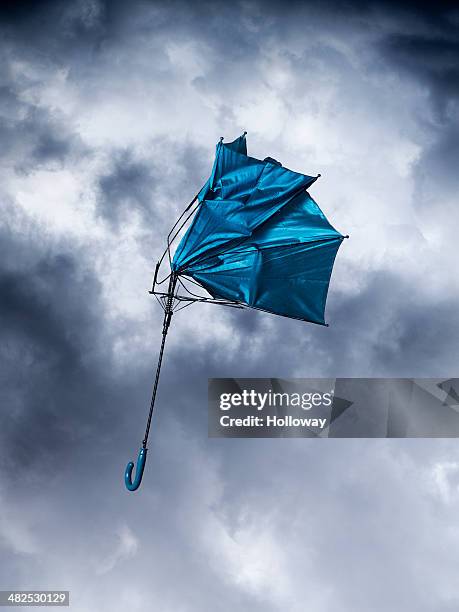 blue umbrella - broken umbrella stockfoto's en -beelden