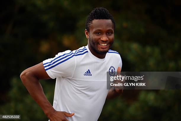 Chelsea's Nigerian midfielder John Mikel Obi attends a team training session at Chelsea's training ground in Stoke D'Abernon, south of London, on...