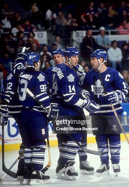 Doug Gilmour, Dave Andreychuk, Wendel Clark, Ken Baumgartner and Dmitri Mironov of the Toronto Maple Leafs celebrate Andreychuk's goal during an NHL...