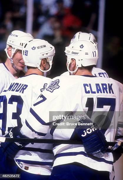 Doug Gilmour and Wendel Clark of the Toronto Maple Leafs celebrate a goal during an NHL game agaisnt the Dallas Stars on March 15, 1996 at the Maple...