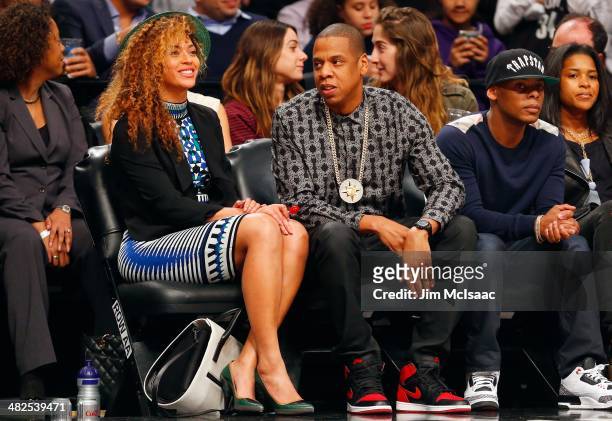 Jay-Z and Beyonce attend a game between the Brooklyn Nets and the Houston Rockets at Barclays Center on April 1, 2014 in the Brooklyn borough of New...