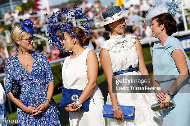 Race goers in the Best Dressed competition on day four of the Qatar Goodwood Festival at Goodwood Racecourse on July 31, 2015 in Chichester, England.