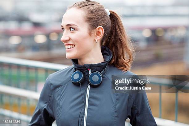 Sporty Young Girl Smiling In Front Of City Scape, Foto de stock