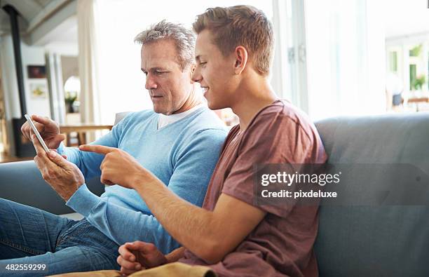 showing his dad a thing or two about pop culture - showing compassion stock pictures, royalty-free photos & images