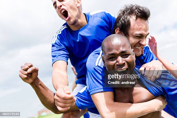 football team celebrating a goal - football team stock pictures, royalty-free photos & images