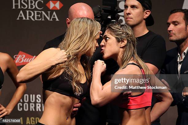 Bantamweight Champion Ronda Rousey of the United States and Bethe Correia of Brazil face off during their UFC 190 weigh-in at HSBC Arena on July 31,...
