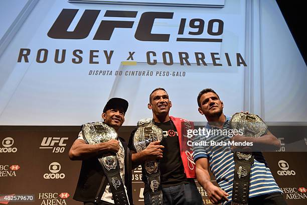 Featherweight Champion Jose Aldo, Heavyweight Champion Fabricio Werdum and Lightweight Champion Rafael dos Anjos of Brazil pose for photographers...