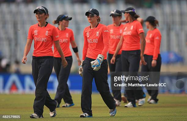 Charlotte Edwards, captain of England leads her team off the field of play during the ICC World Twenty20 Bangladesh 2014 Semi Final match between...