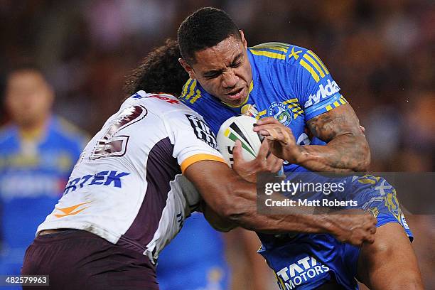 Willie Tonga of the Eels is tackled during the round five NRL match between the Brisbane Broncos and Parramatta Eels at Suncorp Stadium on April 4,...