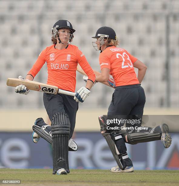 Sarah Taylor and Charlotte Edwards of England score runs during the ICC Womens World Twenty20 Bangladesh 2014 semi final between England and South...