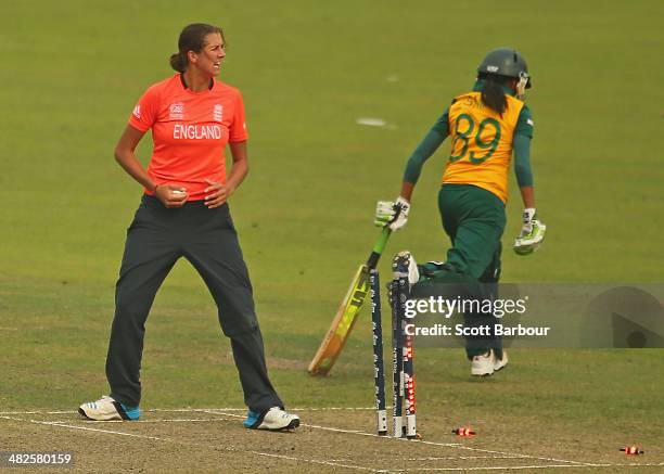 Jenny Gunn of England runs out Shabnim Ismail of South Africa during the ICC Women's World Twenty20 Bangladesh 2014 2nd Semi-Final match between...