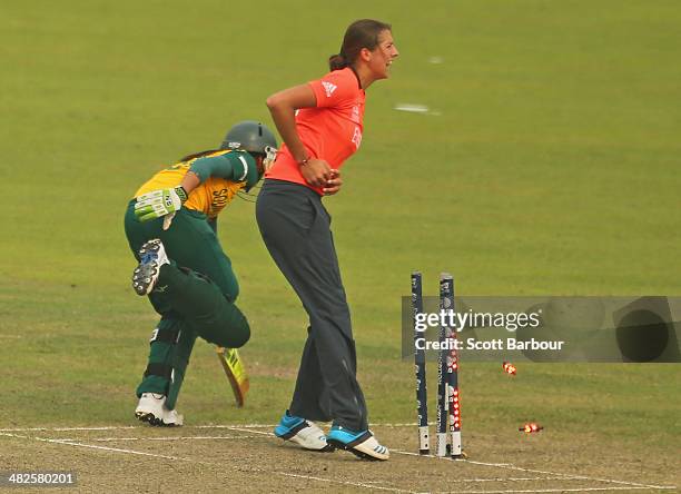 Jenny Gunn of England runs out Shabnim Ismail of South Africa during the ICC Women's World Twenty20 Bangladesh 2014 2nd Semi-Final match between...