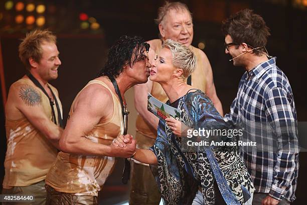 Winner Costa Cordalis kisses TV host Sonja Zietlow during the 1st live show of the television show 'Ich bin ein Star - lasst mich wieder rein!' on...
