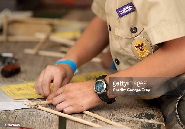 Boy Scouts work on a wood project at camp Maple Dell on July 31, 2015 outside Payson, Utah. The Mormon Church is considering pulling out of its 102...