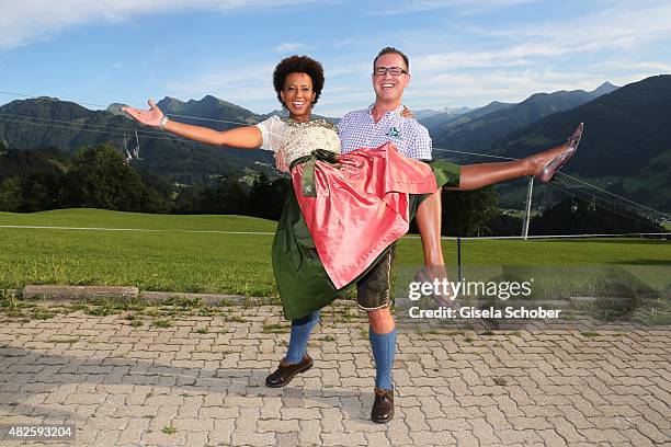 Arabella Kiesbauer and her husband Florens Eblinger during the 12th Almrauschparty at Rosi's Sonnbergstuben on July 31, 2015 in Kitzbuehel, Austria.