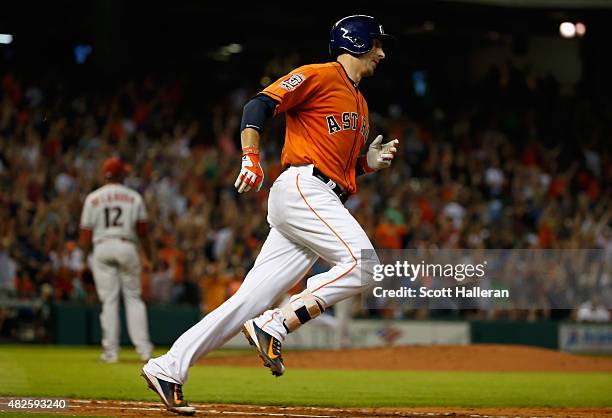 Jason Castro of the Houston Astros trots around the bases after hitting a three-run home run in the fifth inning off Rubby De La Rosa of the Arizona...