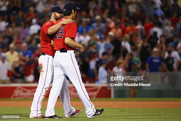 Mike Napoli of the Boston Red Sox and Koji Uehara celebrate after their 7-5 win over the Tampa Bay Rays at Fenway Park on July 31, 2015 in Boston,...