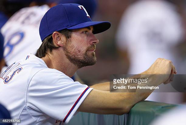 Cole Hamels of the Texas Rangers looks on as the Rangers take on the San Francisco Giants in the bottom of the eighth inning at Globe Life Park in...