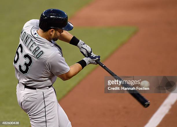 Jesus Montero of the Seattle Mariners hits a solo home run against the Minnesota Twins during the sixth inning of the game on July 31, 2015 at Target...