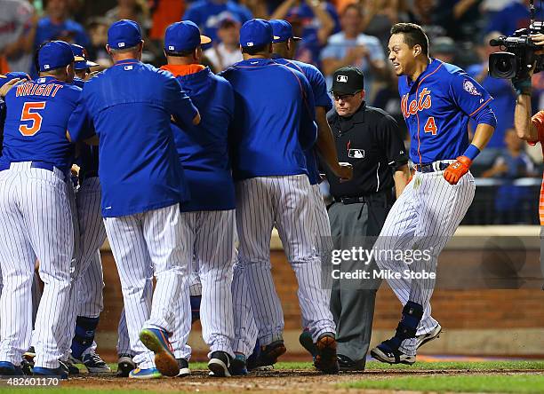 Wilmer Flores of the New York Mets celebrates after hitting a twelfth inning walk-off home run against the Washington Nationals at Citi Field on July...