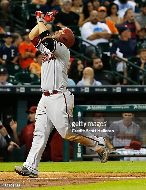 Welington Castillo of the Arizona Diamondbacks celebrates after hitting a solo home run in the tenth inning off Pat Neshek of the Houston Astros...