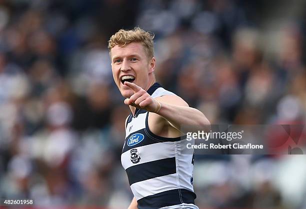 Josh Caddy of the Cats celebrates after scoring a goal during the round 18 AFL match between the Geelong Cats and the Brisbane Lions at Simonds...