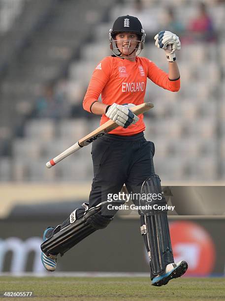 Sarah Taylor of England celebrates hitting the winning runs to win the ICC Womens World Twenty20 Bangladesh 2014 semi final between England and South...