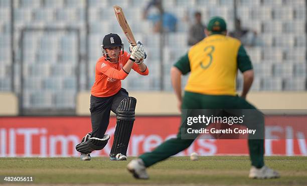 Sarah Taylor of England looks to gets the ball past Sunette Loubser of South Africa during the ICC Womens World Twenty20 Bangladesh 2014 semi final...