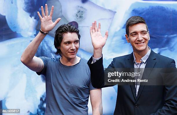 Actors James and Oliver Phelps attend the press conference for the exhibition 'Harry Potter: The Exhibition' on April 4, 2014 in Cologne, Germany....