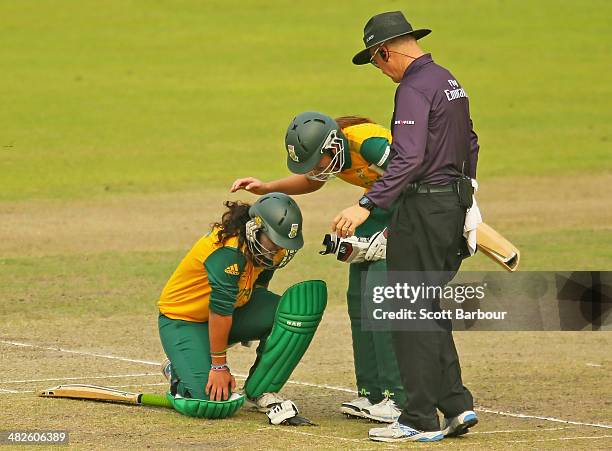 Chloe Tryon and Suné Luus of South Africa console each other after colliding mid pitch as they ran between the wickets which led to Suné Luus being...