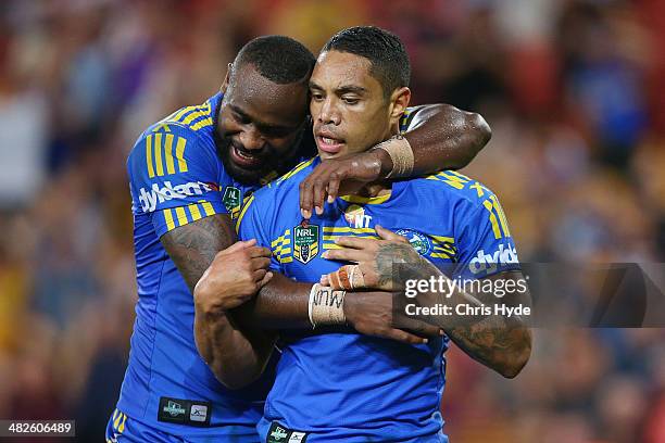 Willie Tonga of the Eels celebrates with team mate Semi Radradra after scoring a breakaway try during the round five NRL match between the Brisbane...