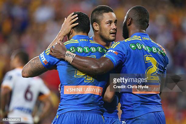 Willie Tonga of the Eels celebrates with team mates Jarryd Hayne and Semi Radradra after scoring a breakaway try during the round five NRL match...