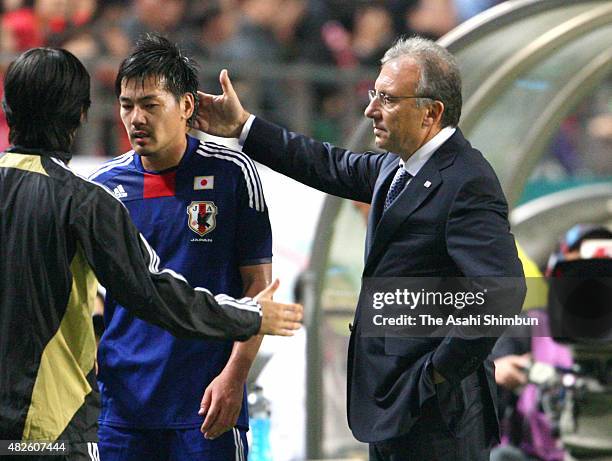 Head coach Alberto Zaccheroni instructs Daisuke Matsui of Japan during the international friendly match between South Korea and Japan at Seoul World...