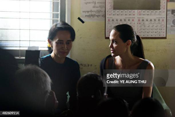 National League for Democracy chairperson Aung San Suu Kyi sits with US actress and UN High Commissioner for Refugees Goodwill Ambassador Angelina...