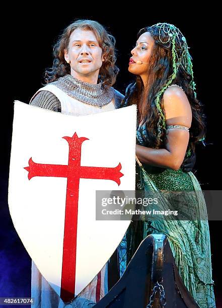 Actors Christian Slater and Merle Dandridge perform onstage during Monty Python Spamalot at the Hollywood Bowl on July 31, 2015 in Hollywood,...